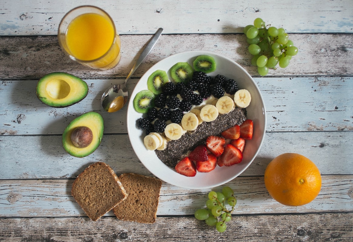 Homemade smoothie with banana, berries, and leafy greens